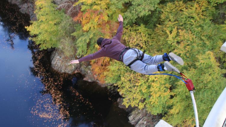 A man bungee jumps