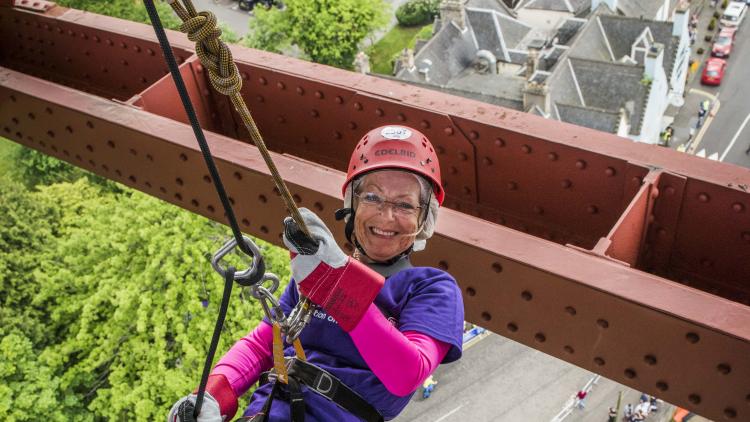Woman abseils down the Forth rail bridge for Alzheimer Scotland