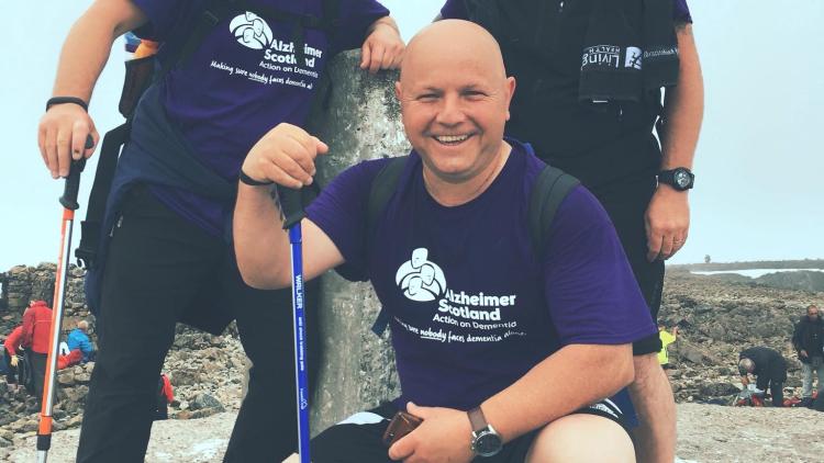 Picture of 3 male fundraisers at top of hill 