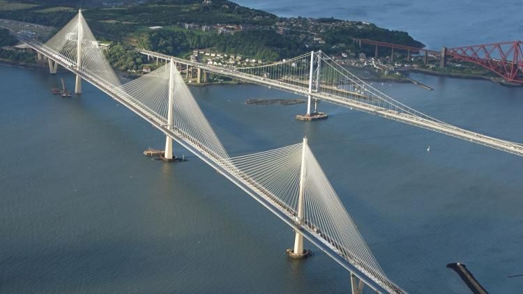 an aerial shot of the Forth Road Bridge and Queensferry crossing