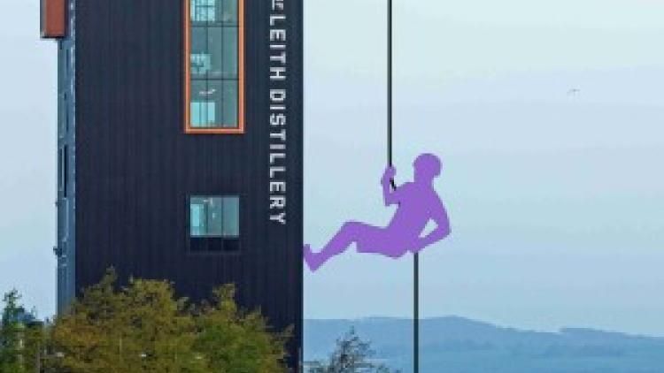 An image of the port of leith distillery with a cartoon of someone abseiling down it